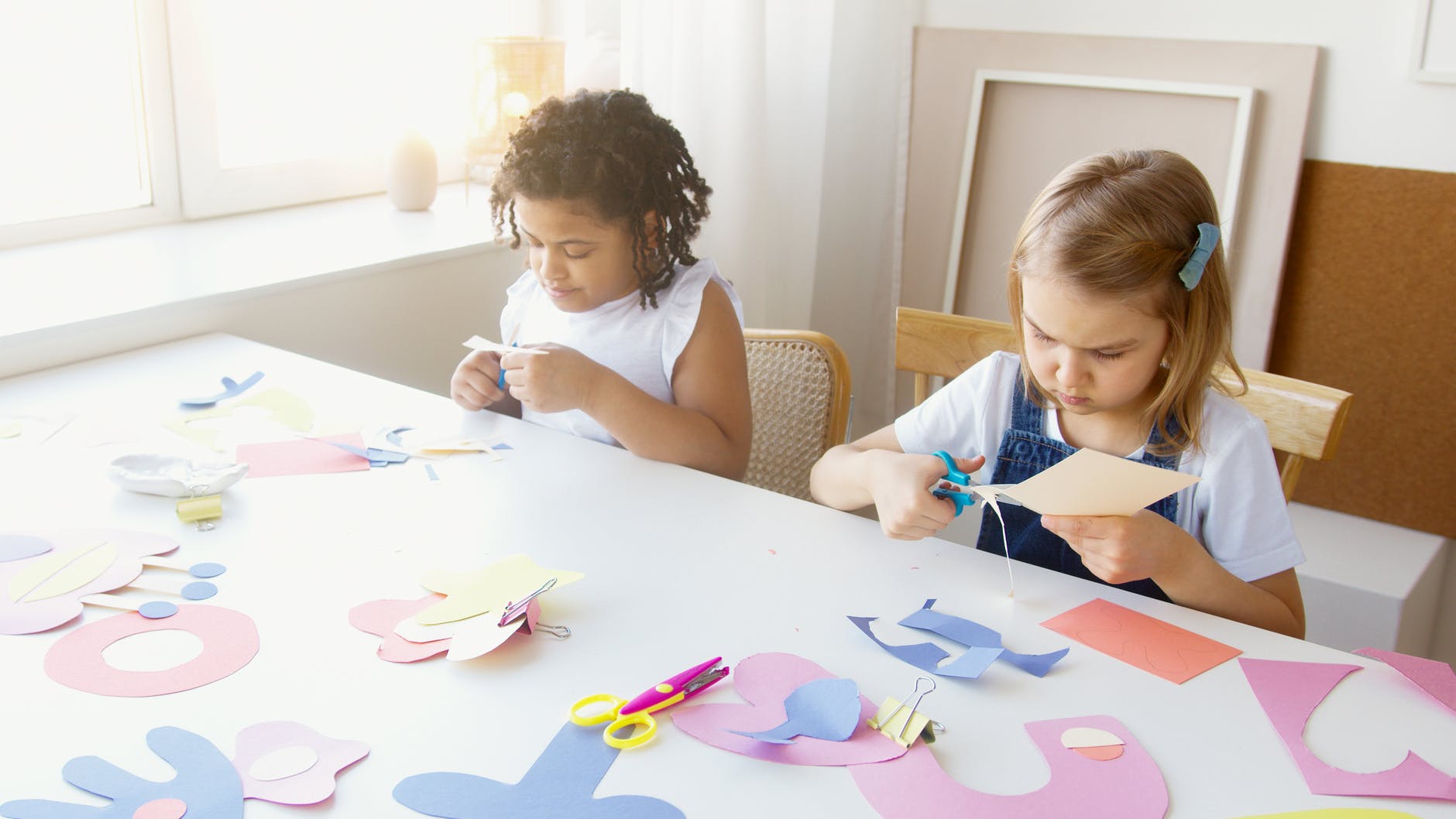 two kids doing some artworks